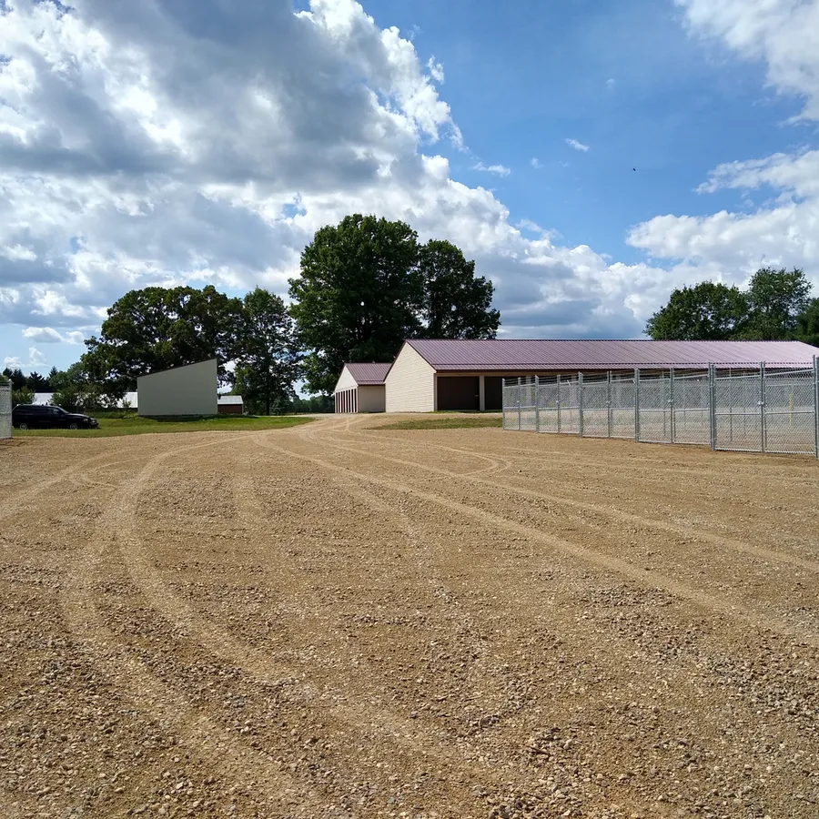 Fenced gravel lot and storage building at My Storage Vestaburg